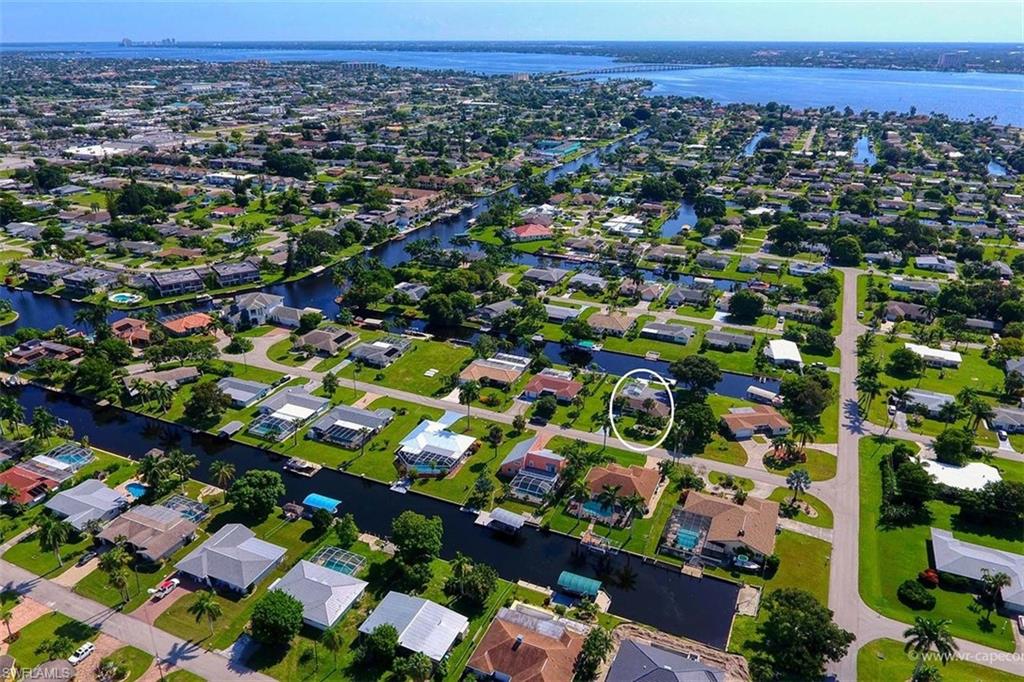 Aerial perspective showcasing a residential community with water access