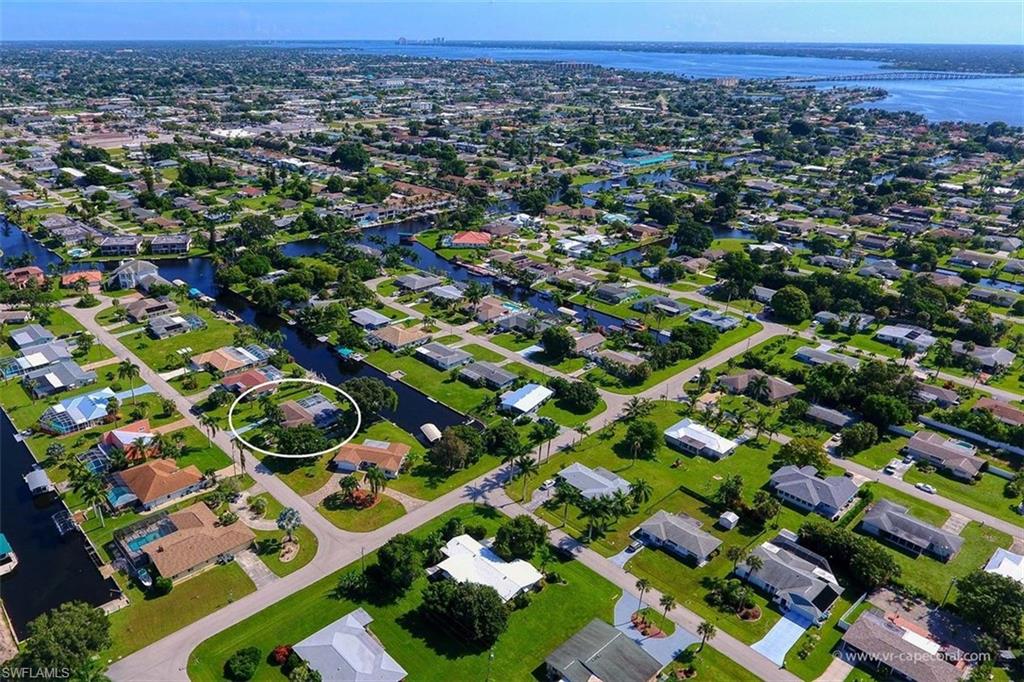 Aerial perspective of a residential neighborhood featuring numerous canal-front properties