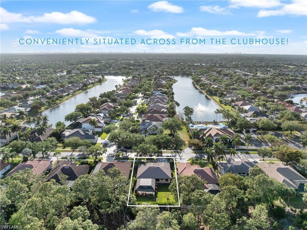 Aerial perspective of suburban area featuring property parcel outlined and a large body of water