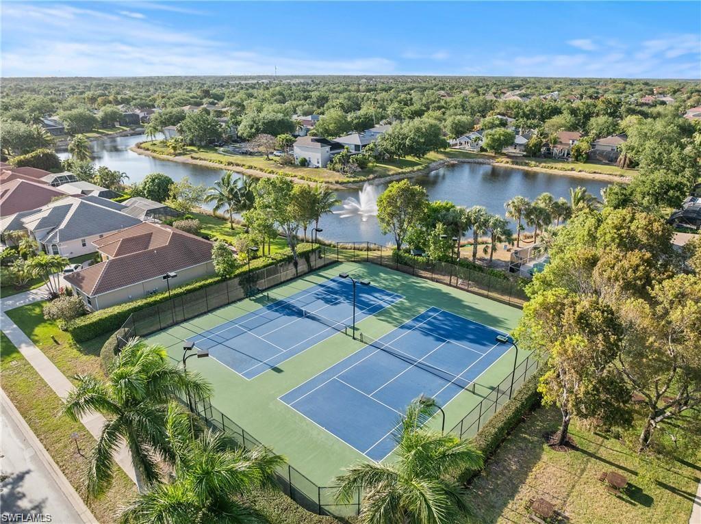 Aerial overview of property's location featuring a nearby body of water and nearby suburban area