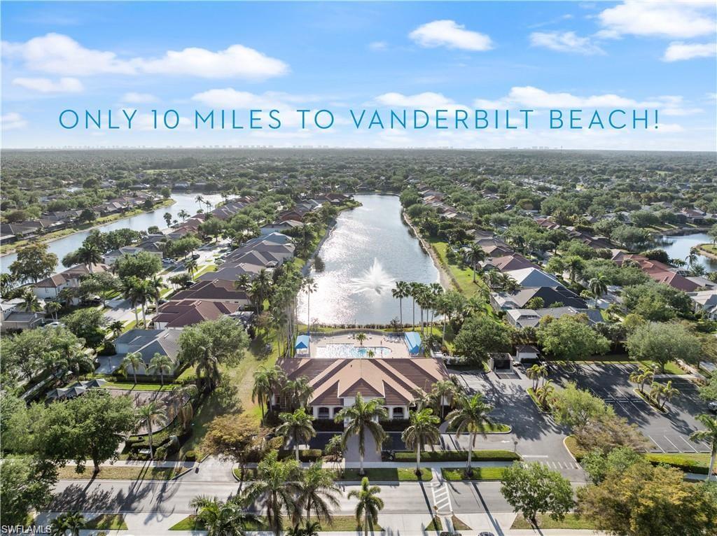 Aerial perspective of suburban area featuring a large body of water