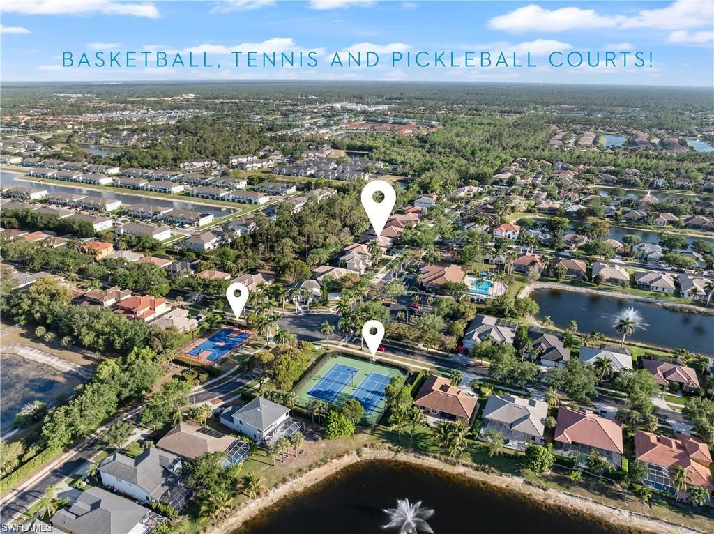 Aerial overview of property's location featuring a nearby body of water and nearby suburban area