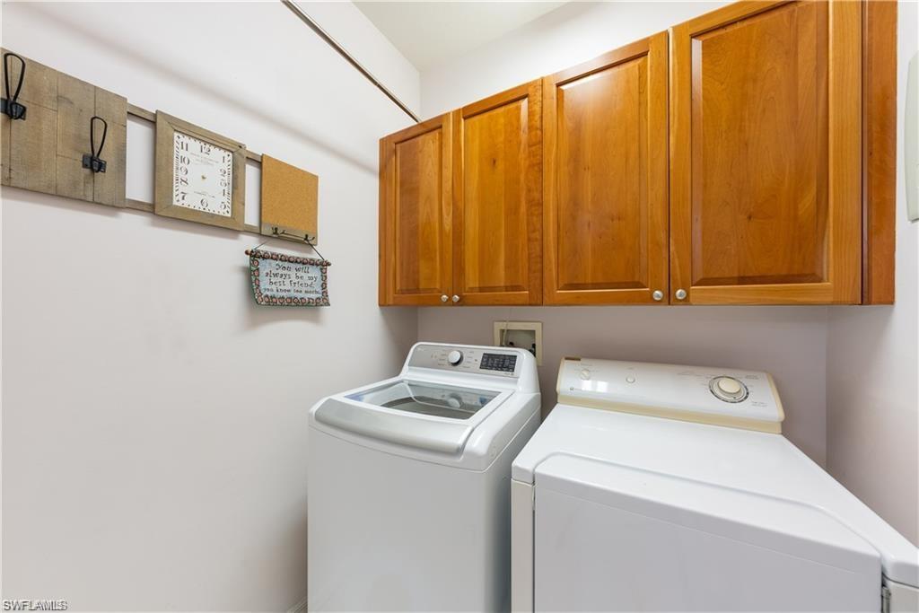 Washroom with cabinet space and separate washer and dryer