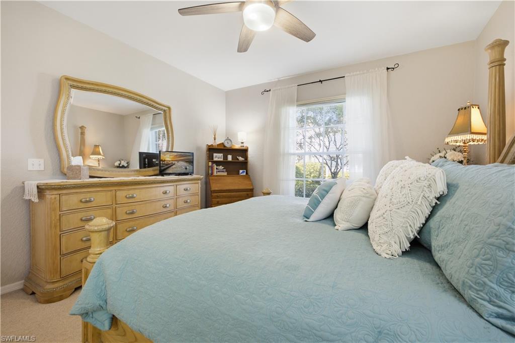 Room featuring light-toned walls and a ceiling fan with integrated lighting