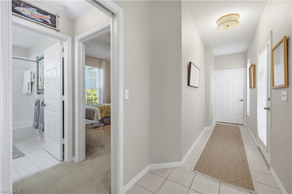 Entry hall with tile flooring and a flush-mount ceiling light