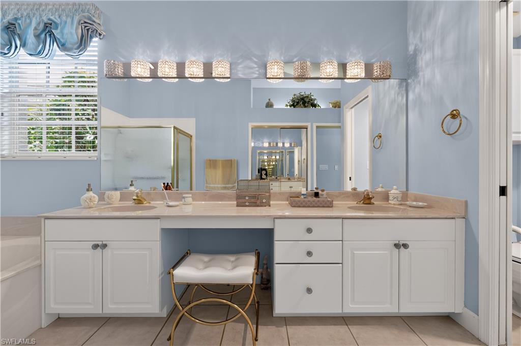 Double vanity with light countertops and undermount sinks
