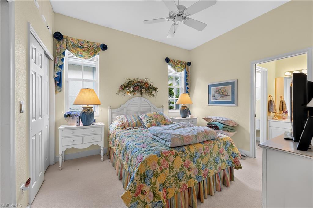 Bedroom featuring high vaulted ceilings, a ceiling fan, and carpet flooring