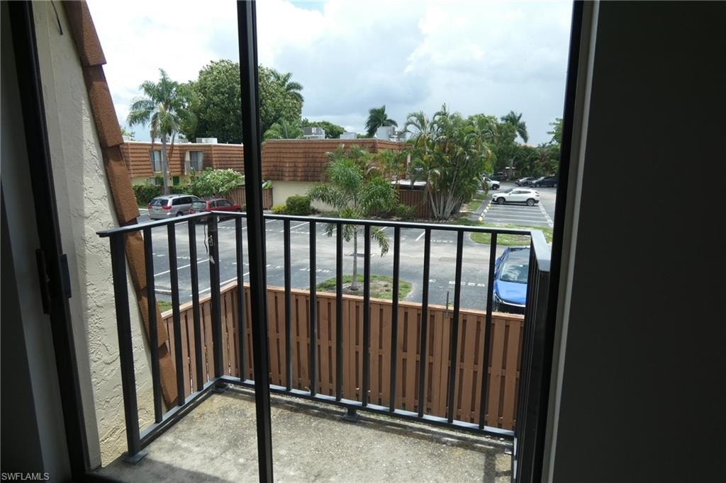 Private balcony featuring a concrete floor and black metal railing