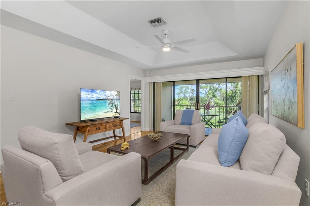 Living room is beautifully appointed with modern updated chairs and couch