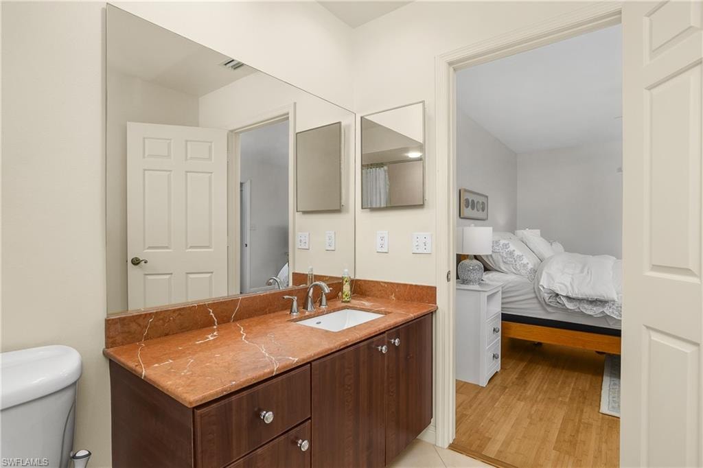 Bathroom with vanity and wood finished floors