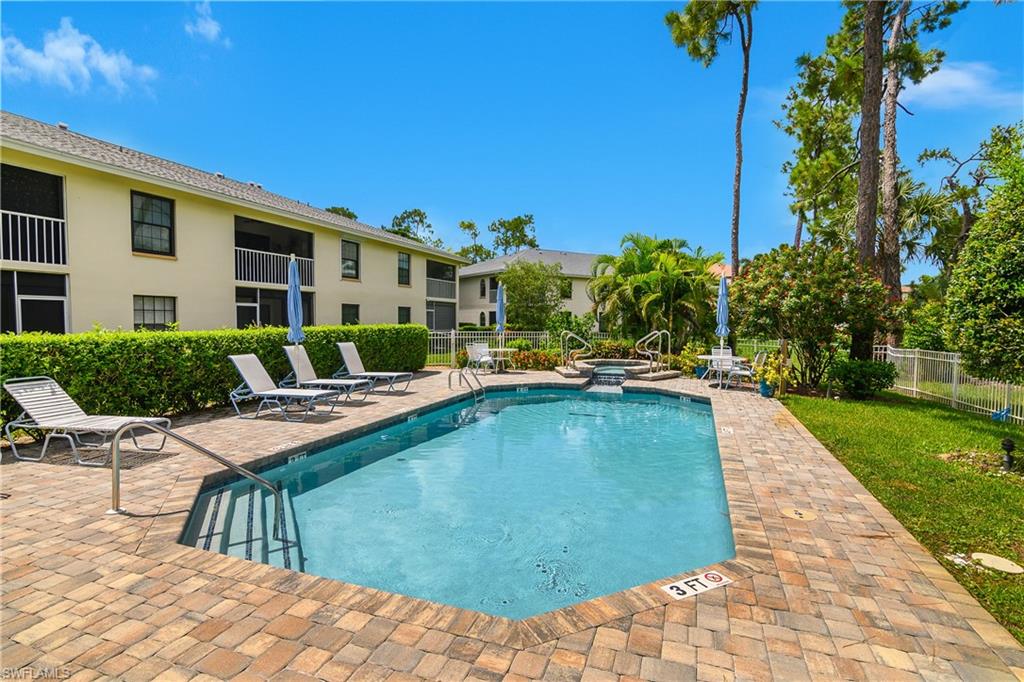 Community pool with a patio and a community spa just steps from this unit