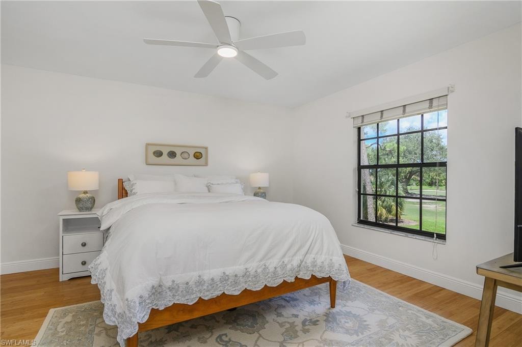 Bedroom featuring light wood-style flooring and ceiling fan