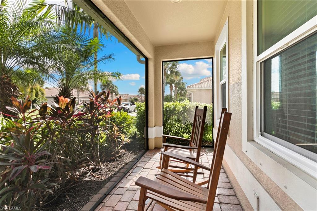Large front porch with panoramic screen enclosure.