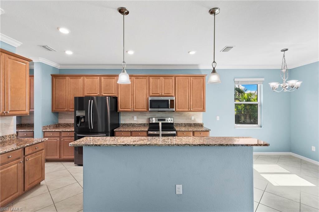 Modern kitchen with large center island that provides plenty of room for meal preparation and casual seating.
