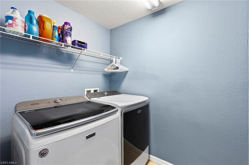 Upstairs laundry with new washer and dryer.