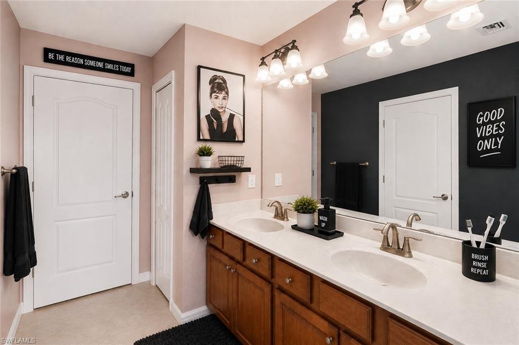 Virtually staged Jack and Jill bathroom.