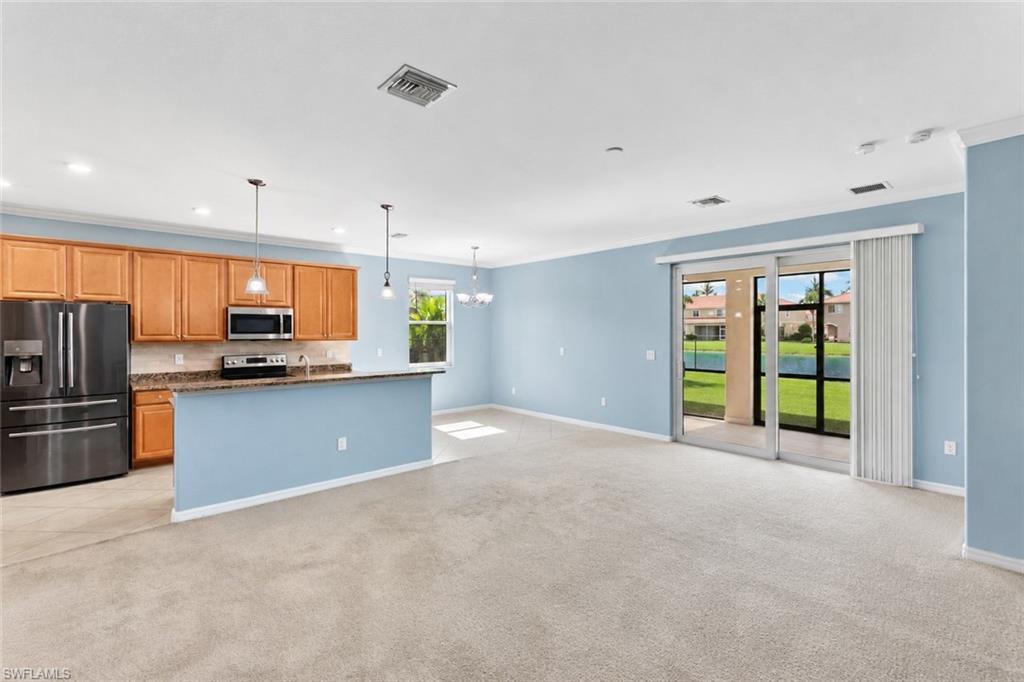 Spacious great room filled with natural light and peaceful lake views