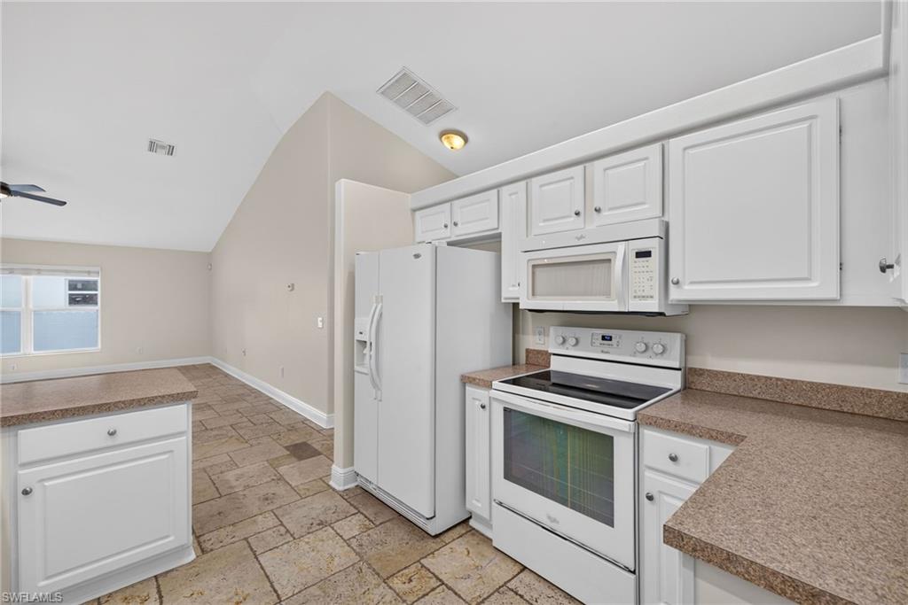 Kitchen with rear living room beyond