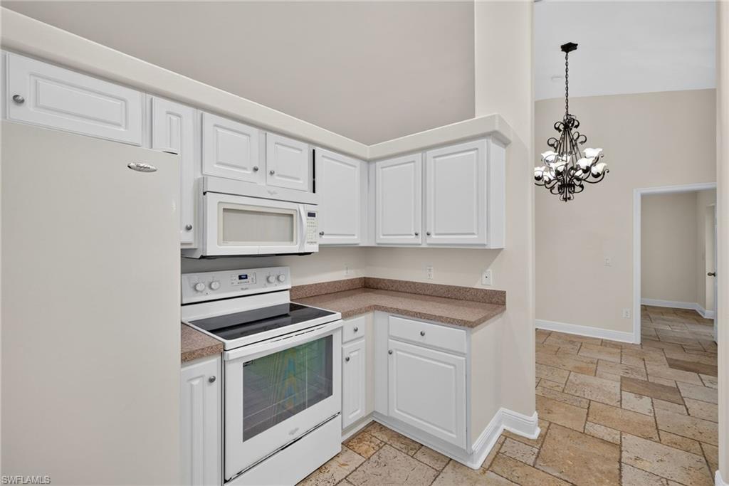 Kitchen with dining room beyond