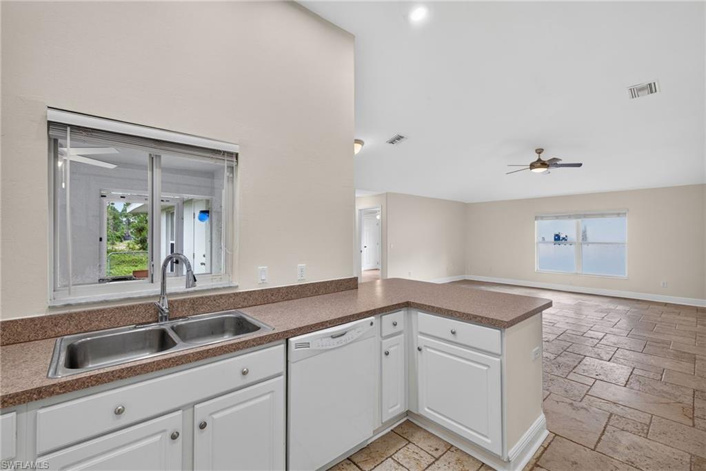 Kitchen with rear living room beyond
