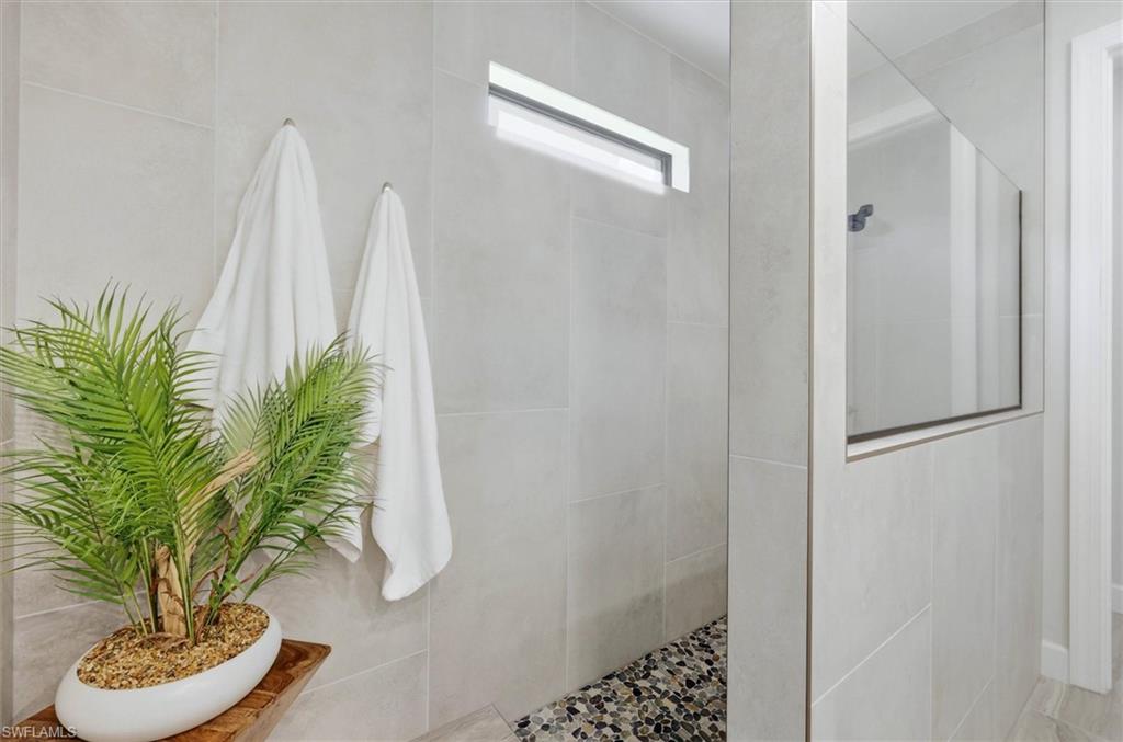 Primary Bath Oversized Shower w/stone floor