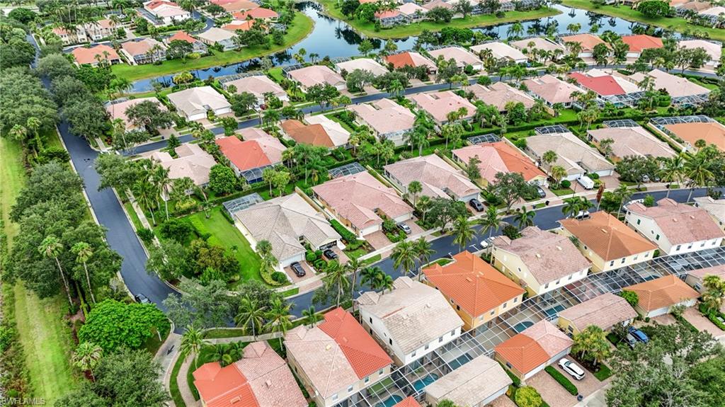 Aerial perspective showcasing a residential community with varied rooflines, mature landscaping, and curved streets