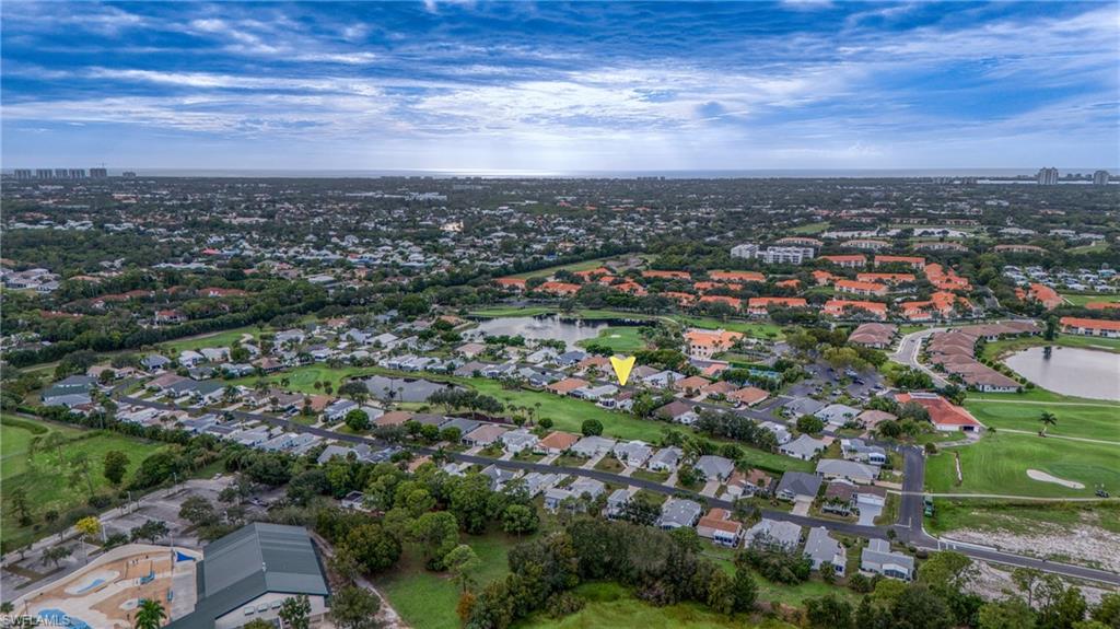 Aerial perspective showcasing a residential community with abundant green spaces