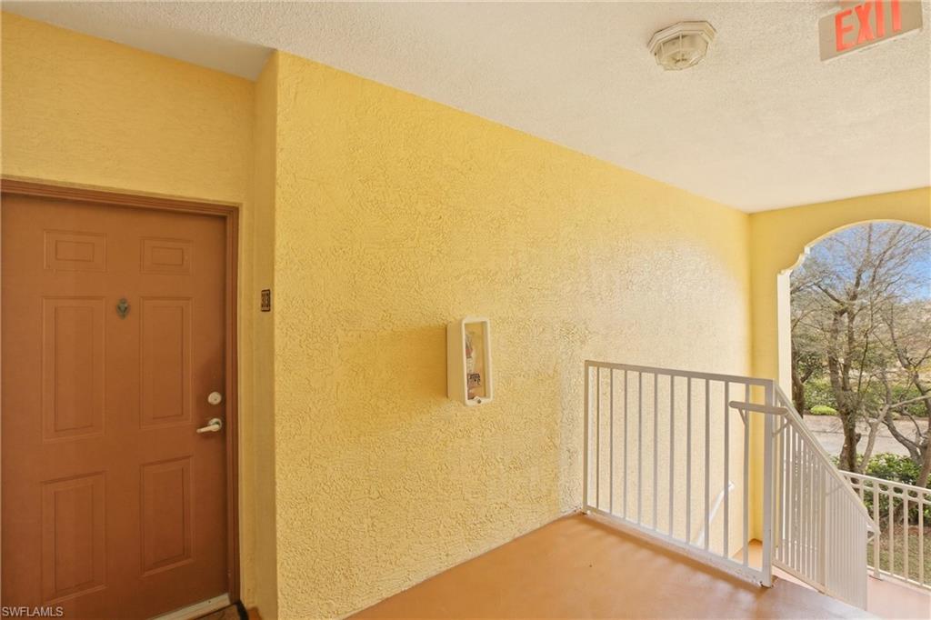 Doorway to property with stucco siding