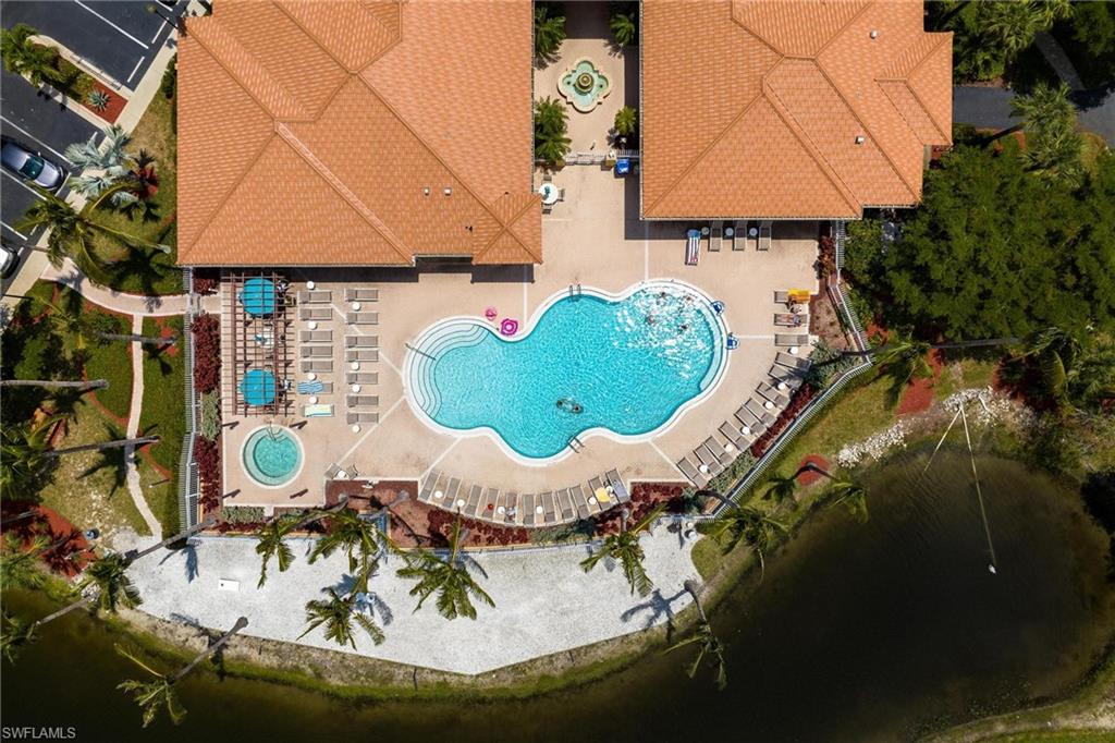 Drone / aerial view of a Community pool and clubhouse