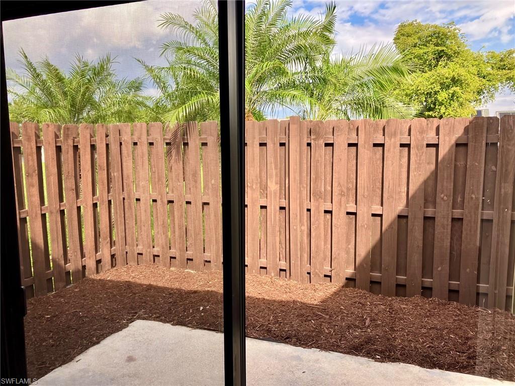 Private, fenced patio area off downstairs bedroom and living room