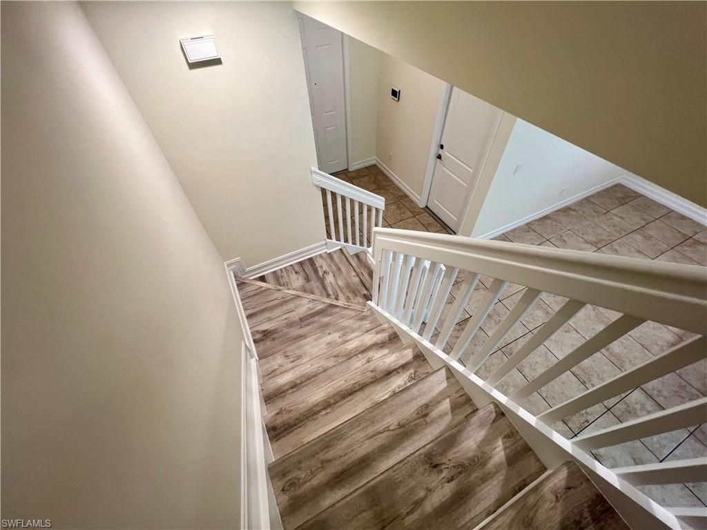 Stairway with luxury vinyl plank / wood-style flooring