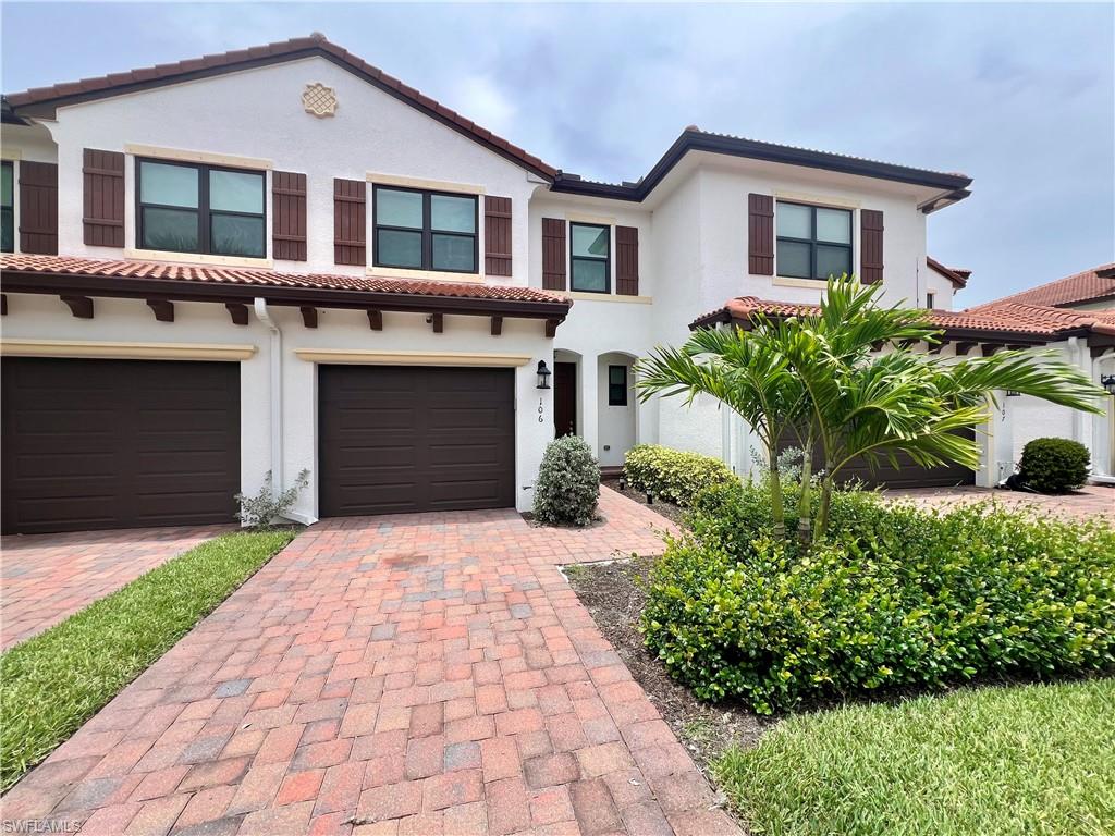 Mediterranean / spanish house featuring a garage
