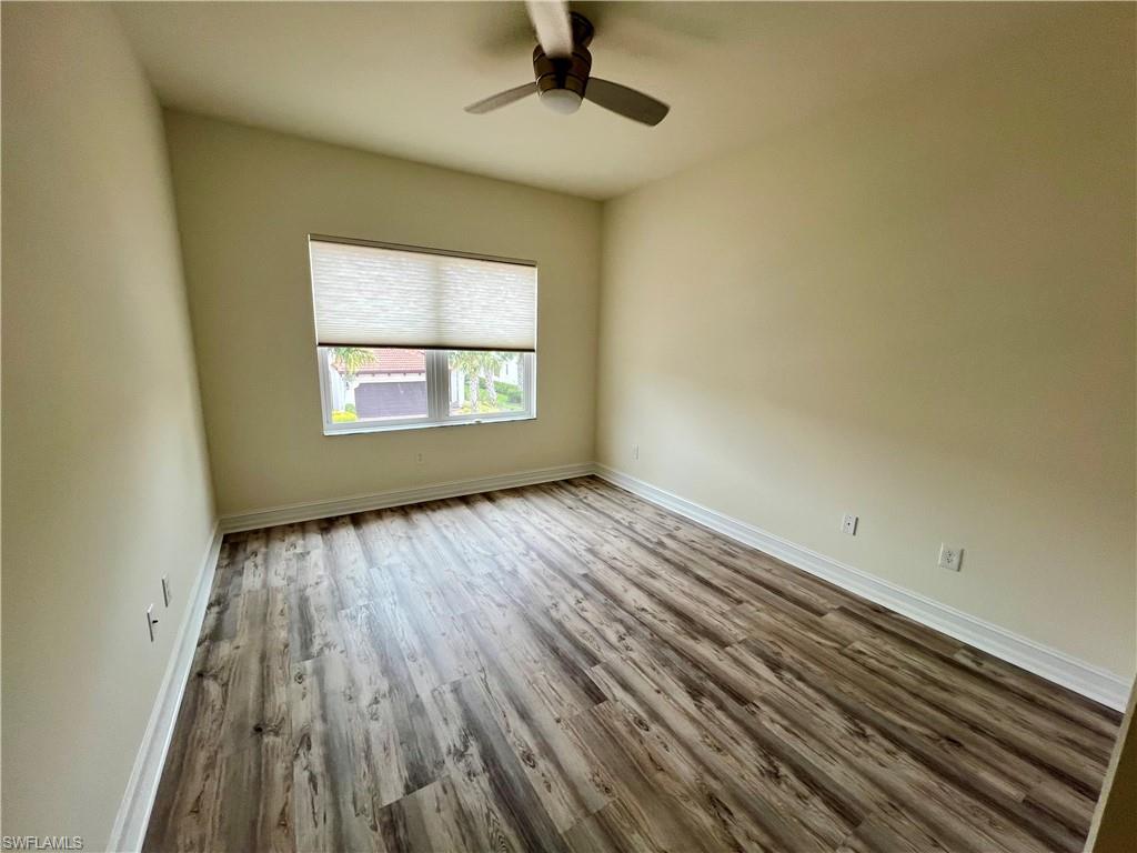 Unfurnished room featuring luxury vinyl plank / wood-style floors and ceiling fan