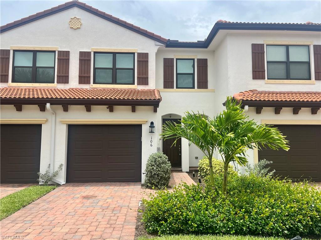 Mediterranean / spanish-style home featuring a garage