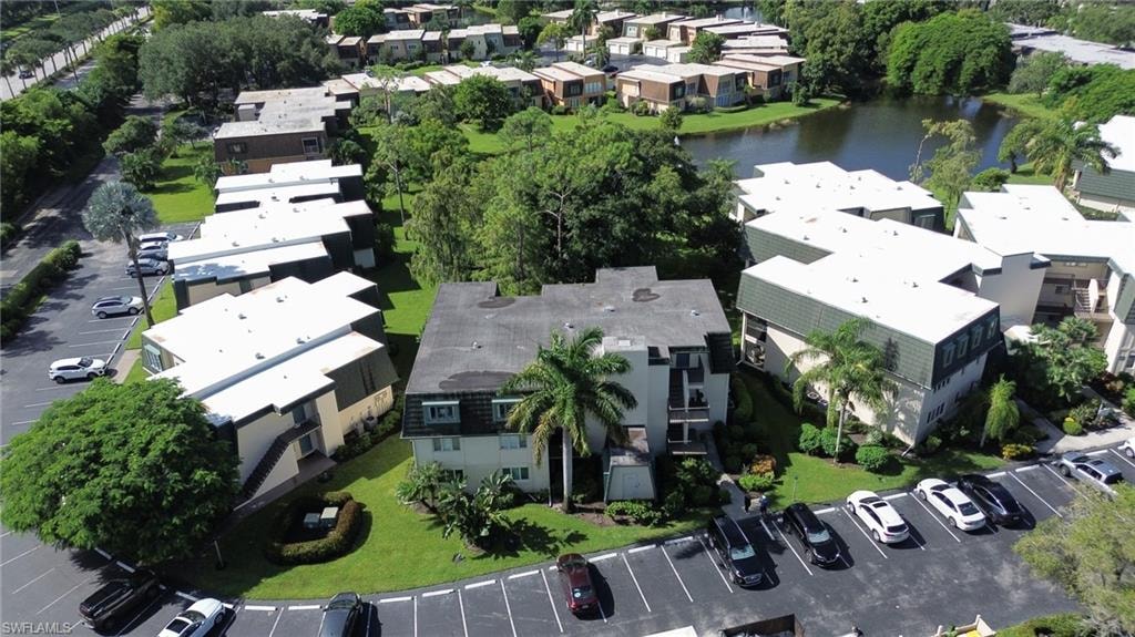 Bird's eye view with a water view and a residential view