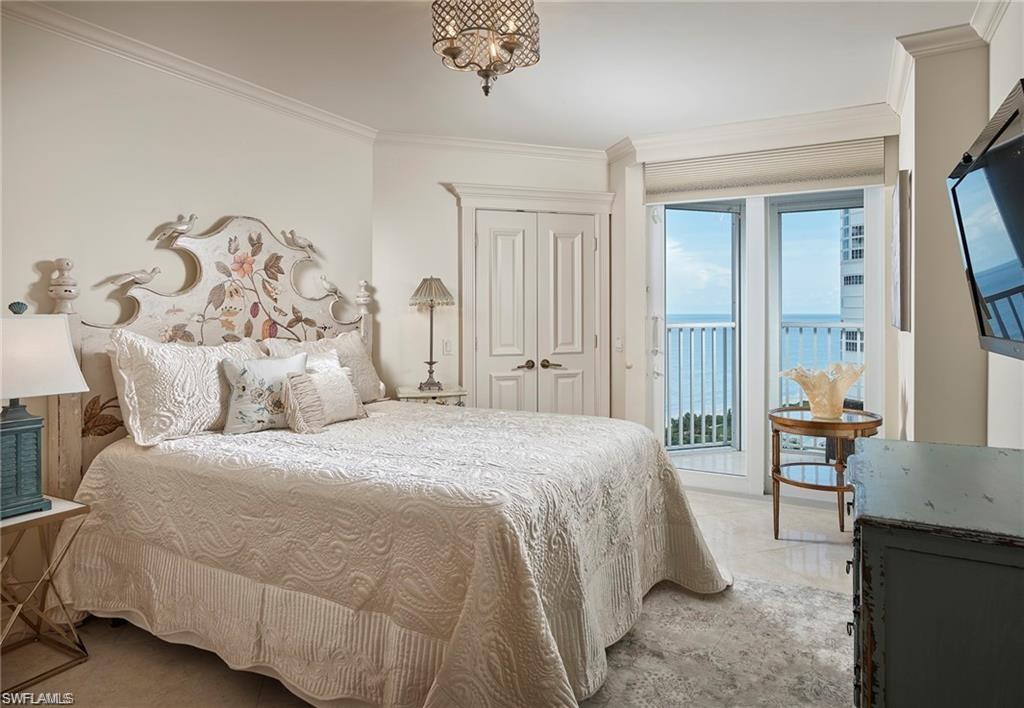 Bedroom featuring ornamental molding and access to exterior
