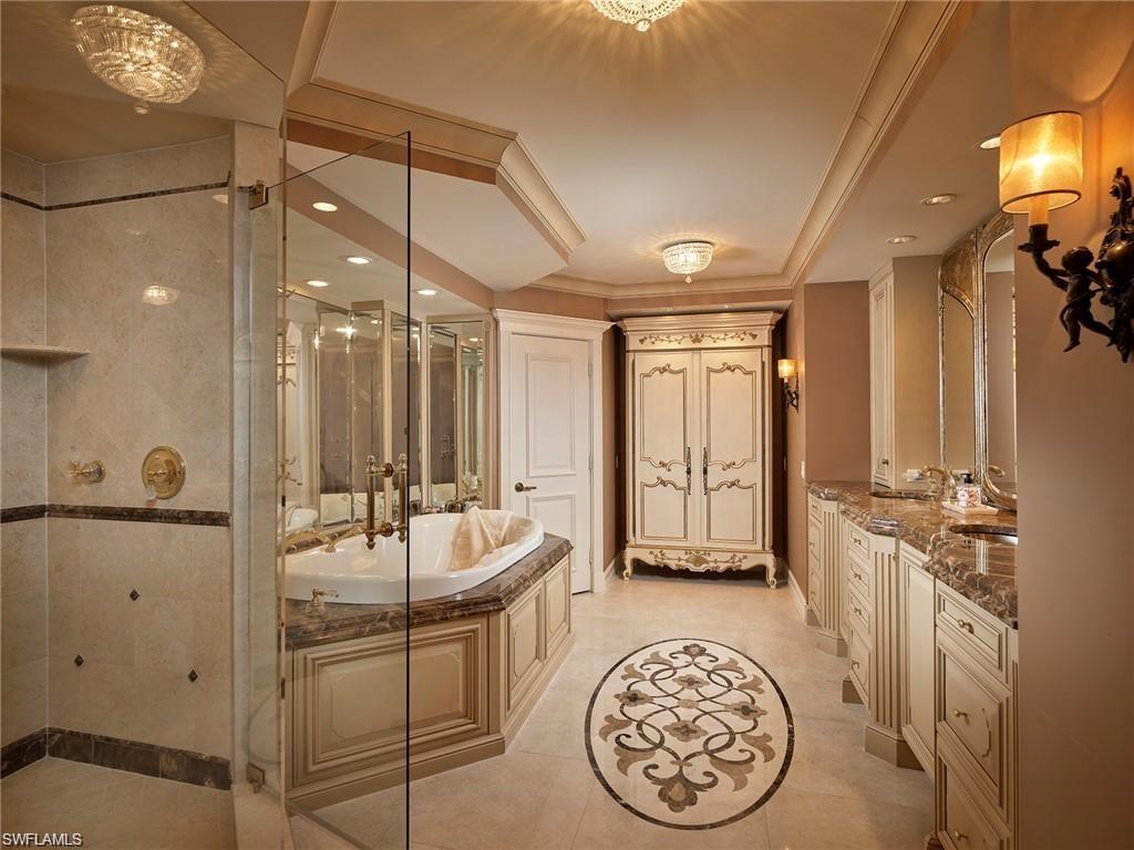 Bathroom with vanity, plus walk in shower, and tile patterned flooring