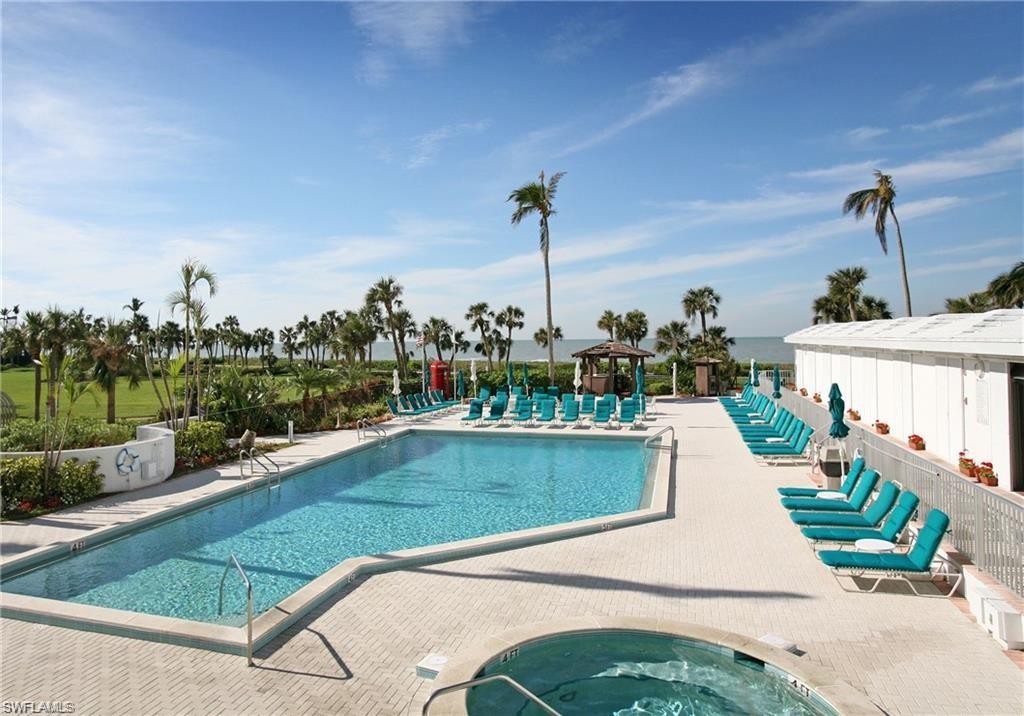 View of pool featuring a patio area and a hot tub