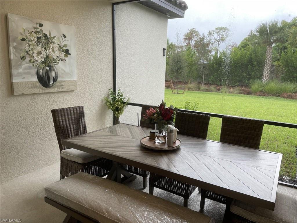 Screened lanai with table seating for eight