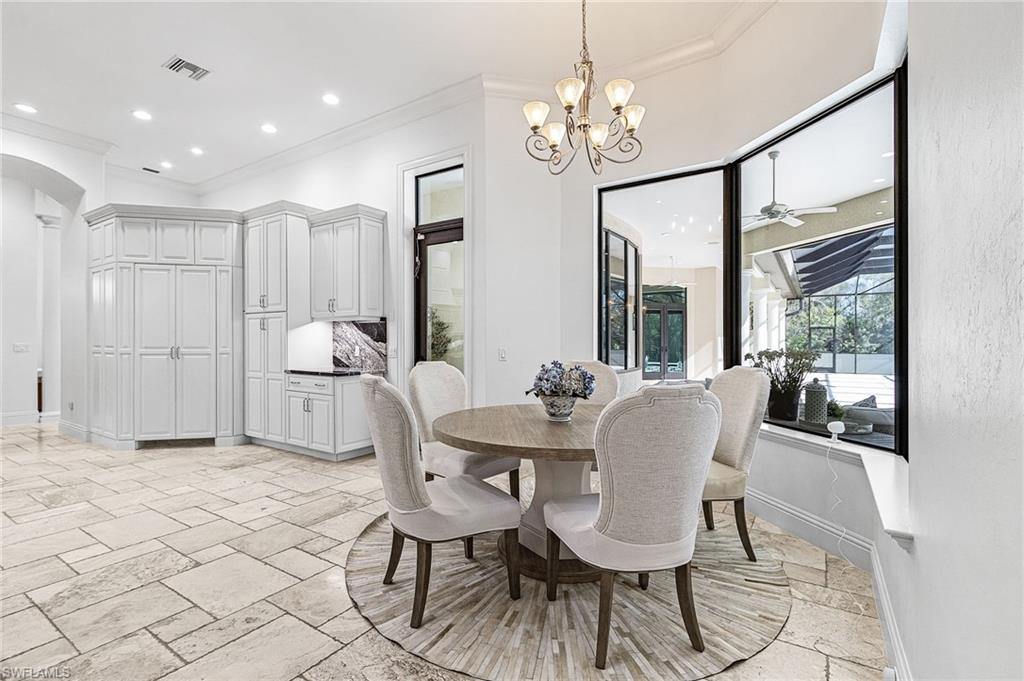 Spacious dining area featuring a bay window, recessed lighting, and tile flooring