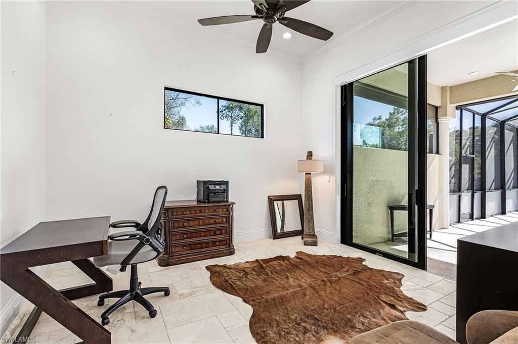 Interior room featuring light-toned tile flooring, a horizontal window, and a ceiling fan