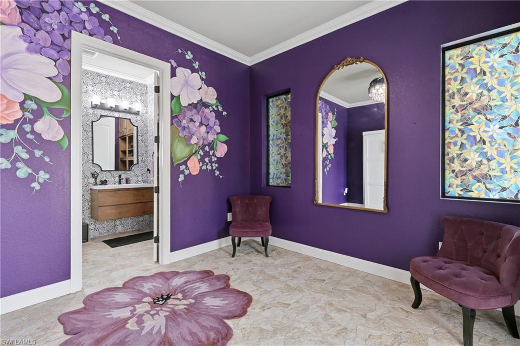 Cabana featuring purple walls with floral murals, crown molding, and light-toned tile flooring