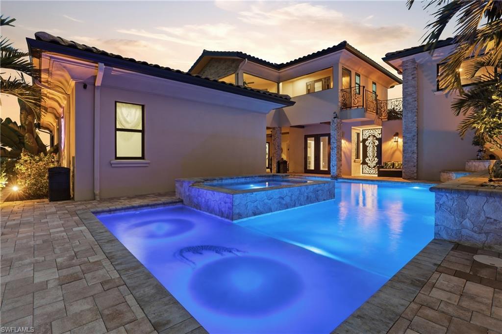 Lighted pool with waterfall feature