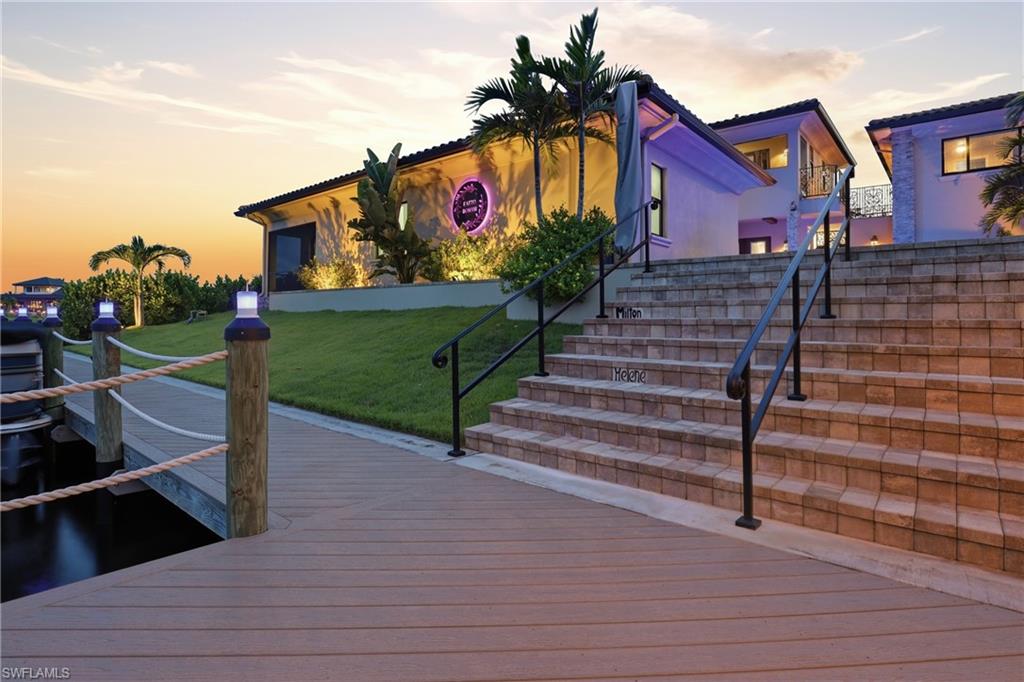 Stairs from dock to lighted pool area