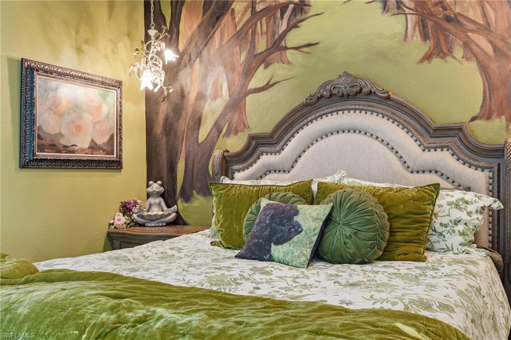 Ornate upholstered headboard with nailhead trim
