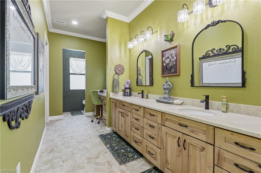 Dual vanity with light-tone countertops and under-mount sinks