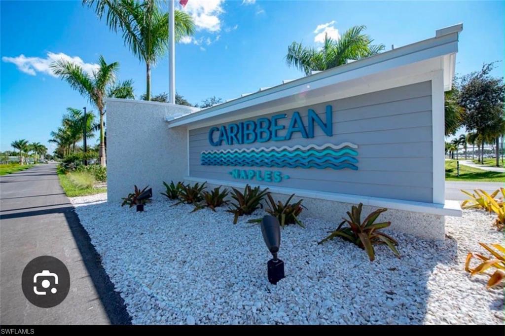 Caribbean Naples community entrance sign featuring horizontal siding and dimensional lettering