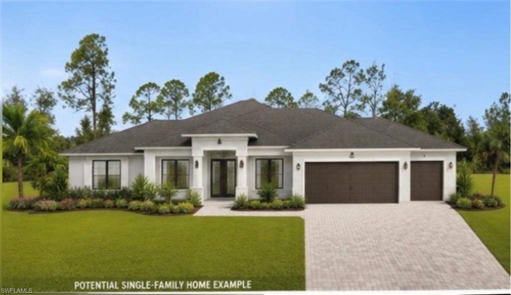 Contemporary single-story residence featuring a dark shingle roof and a light-colored stucco exterior
