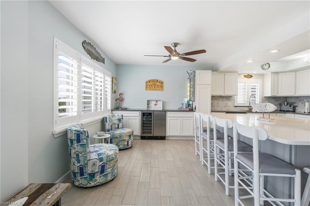 White plantation shutters and light wood-finish flooring - Virtually Edited Image