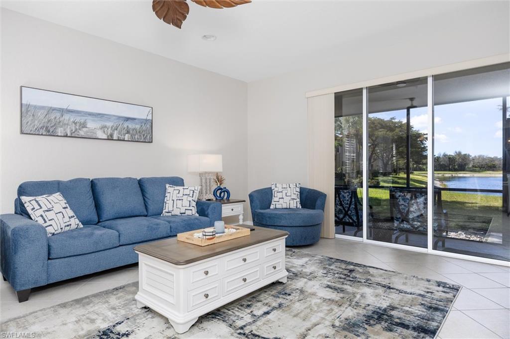 Living area featuring tile flooring, a recessed light, and a ceiling fan